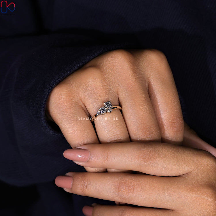 Diamondsbyuk engagement ring with yellow gold cluster.

