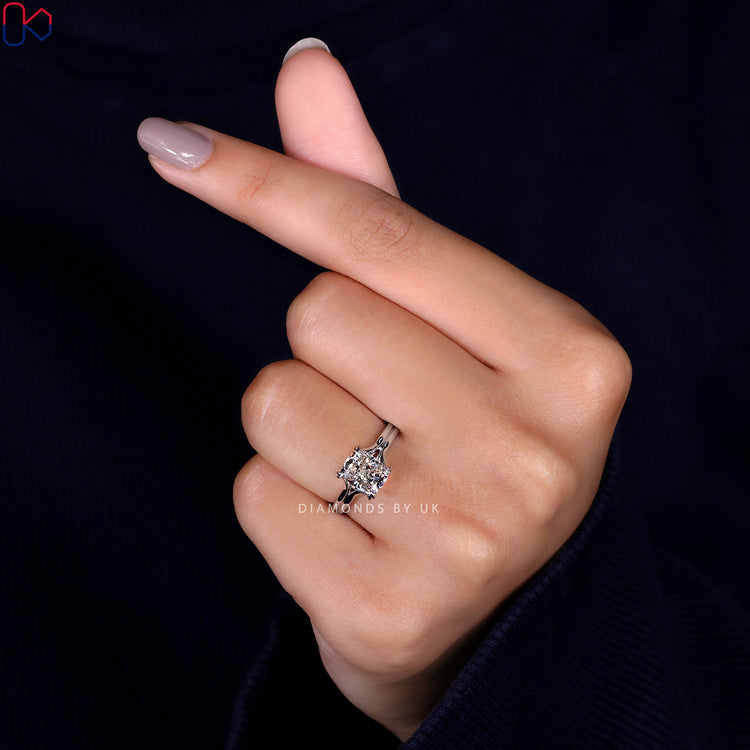 Handmade jewellery featuring a cushion cut diamond in a trellis setting.