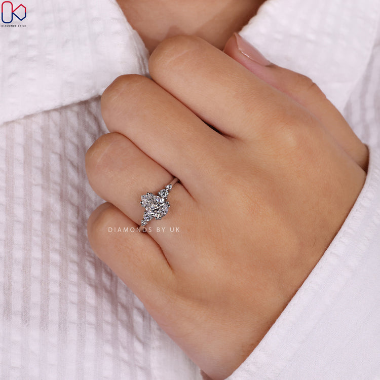 Pear Shaped Diamond Ring with round side stones.
