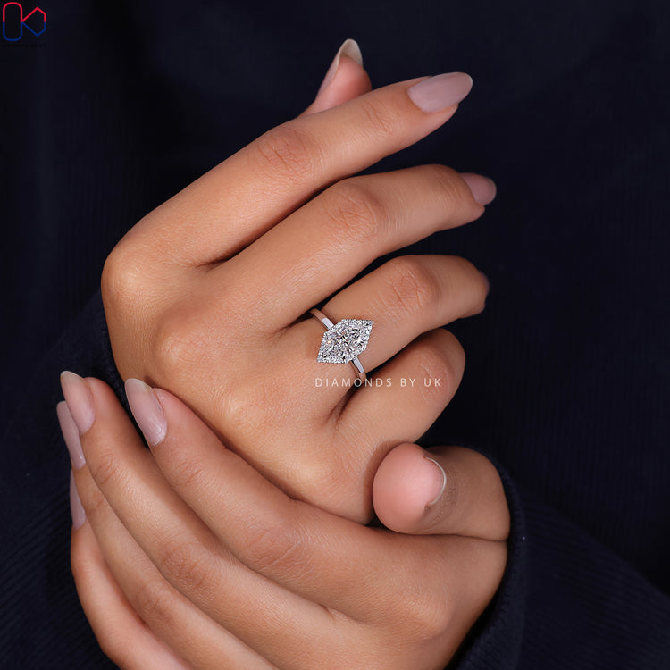 White gold ring featuring a striking Dutch Marquise engagement design.
