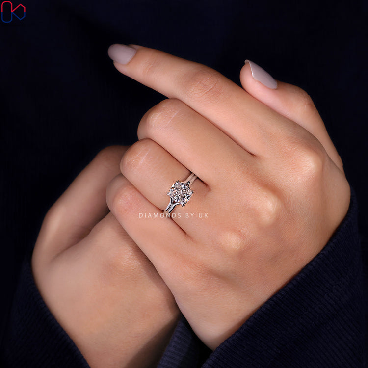 Peekaboo diamond ring set in a trellis setting ring.