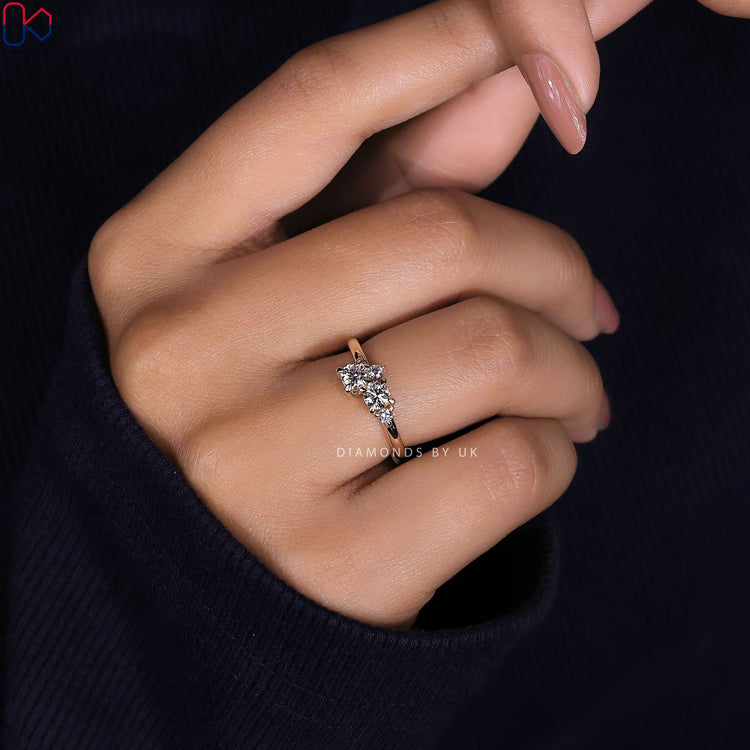 Cluster ring featuring four round lab grown diamonds.
