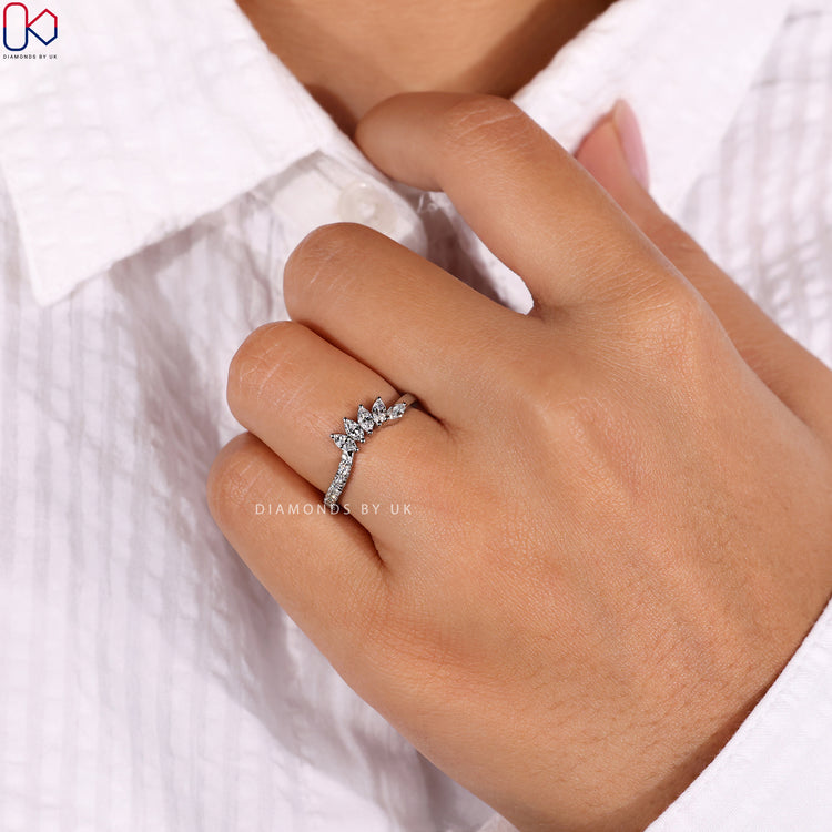 Classic round diamond wedding band with a tiara design for timeless elegance.
