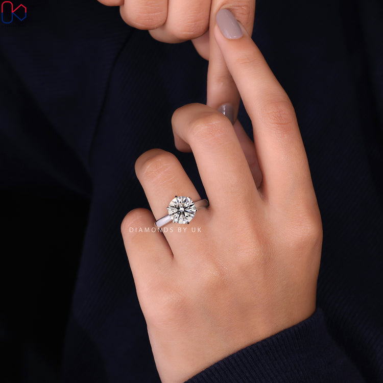 Handmade ring with a round diamond in a classic solitaire setting.