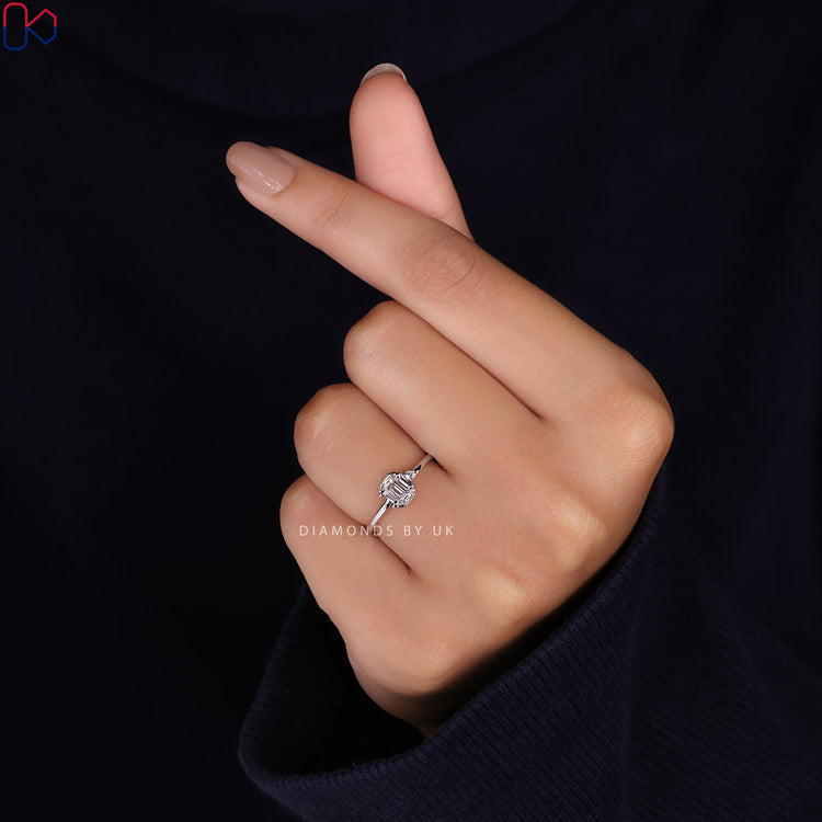 Diamondsbyuk engagement ring featuring two diamonds in a prong setting.
