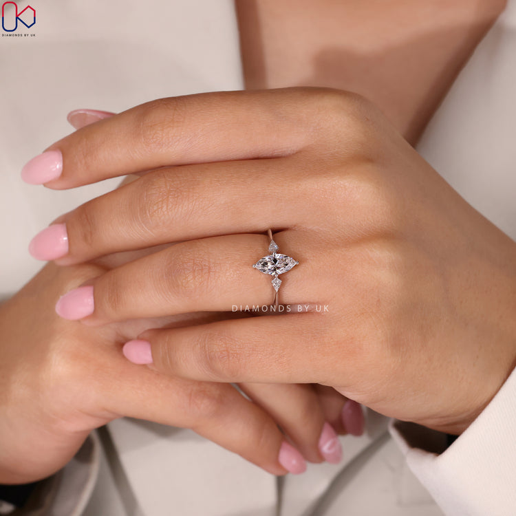 IGI Certified Engagement Ring featuring marquise and round diamonds.
