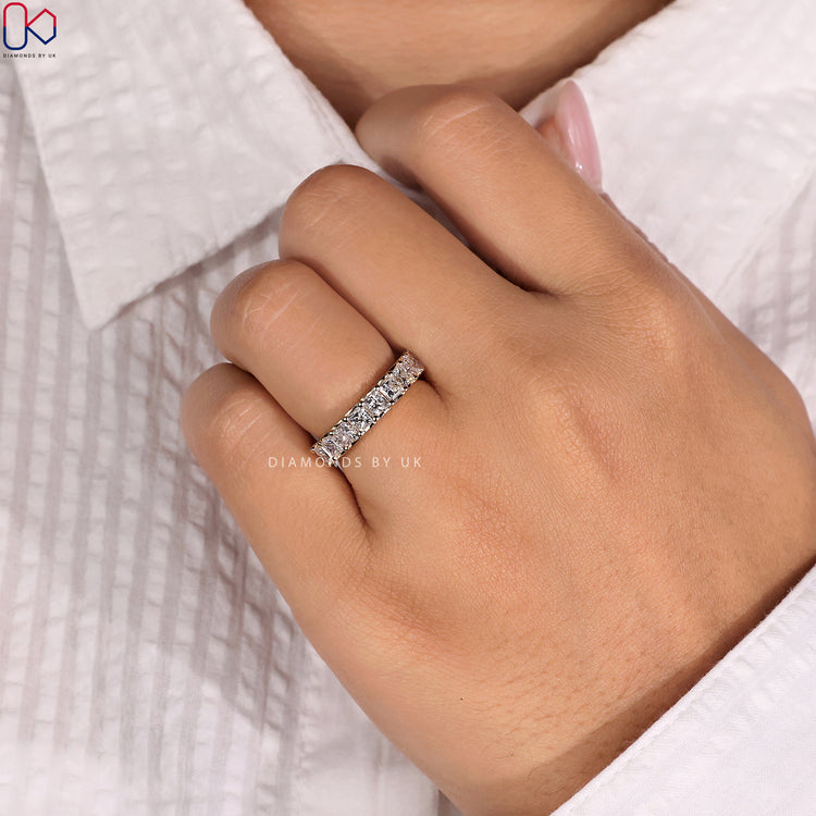 Lab grown diamond princess cut eternity band offering eco-friendly elegance.
