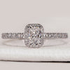 Radiant cut ring with halo and pavé diamond style.