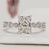 Radiant cut engagement ring with marquise side stones.
