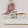 Radiant cut ring with round side stones design.
