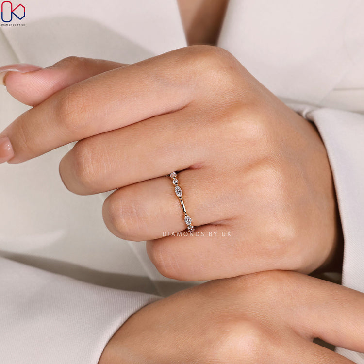 Round and marquise Band with shared prong setting.