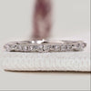Round and marquise diamond band in half eternity style.