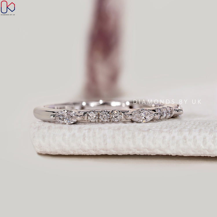 Handmade round and marquise diamond band by Diamondsbyuk.
