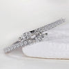 Round and marquise diamond band with bypass setting.