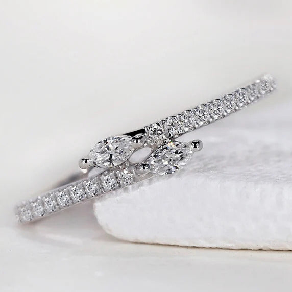 Round and marquise diamond band with bypass setting.