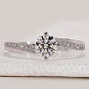 Round cut ring with bypass pavé diamond setting.