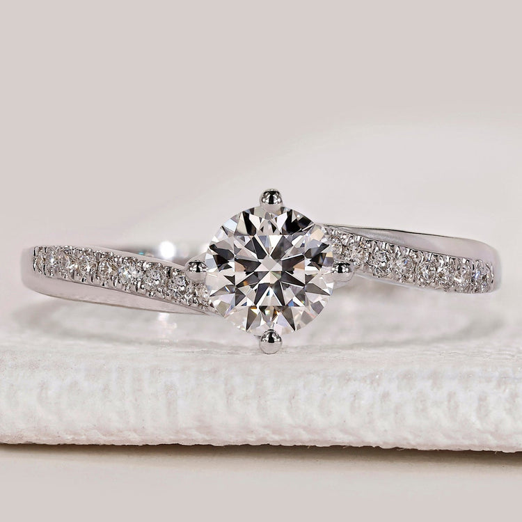 Round cut ring with bypass pavé diamond setting.
