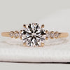 Round cut diamond ring with seven stone setting.