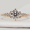 Round cut diamond ring with seven stone setting.