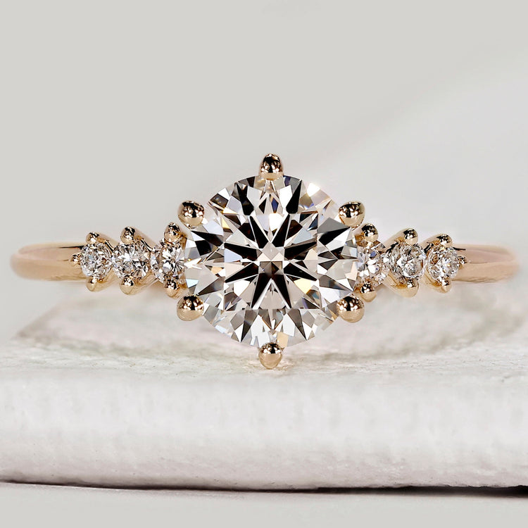 Round cut diamond ring with seven stone setting.