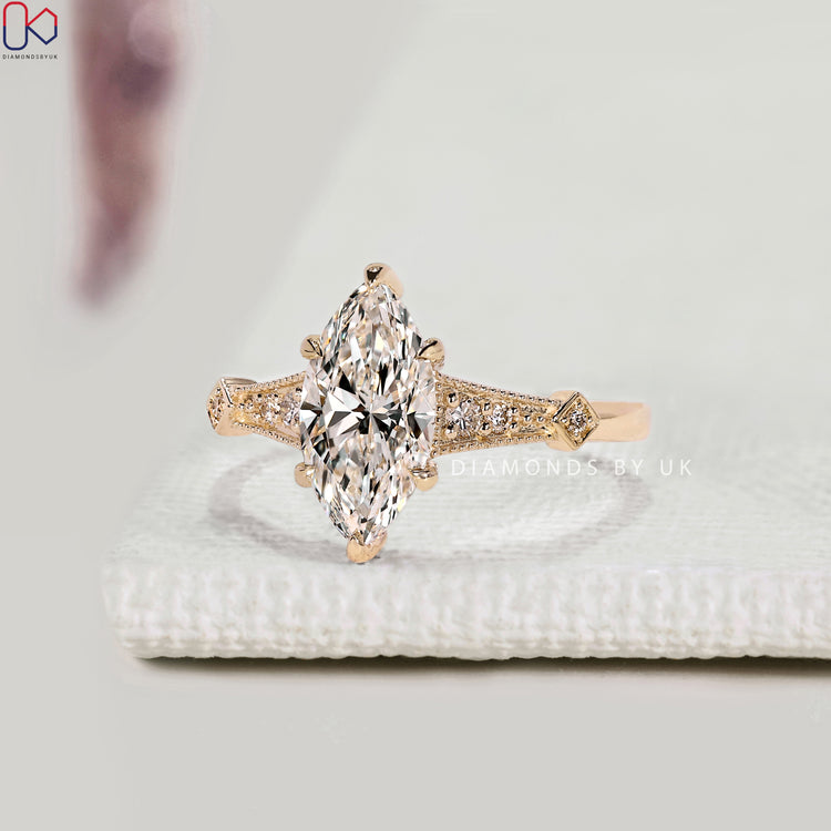 Nature inspired marquise engagement ring with claw prongs.
