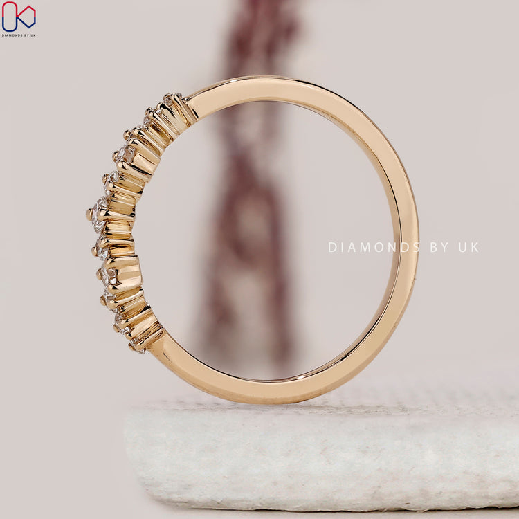 Round diamond half eternity wedding band with a sleek, handmade finish.
