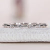 Round cut diamond wedding band with half eternity style.
