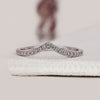 Round diamond wedding band in a chevron shape crafted for a modern bridal look.
