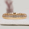 Round diamond band with one sided pavé and knife edge style.
