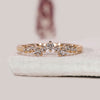 Round diamond wedding band crafted in yellow gold with a soft curvy profile.
