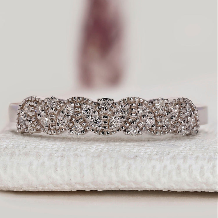 Round diamond band with half eternity style.