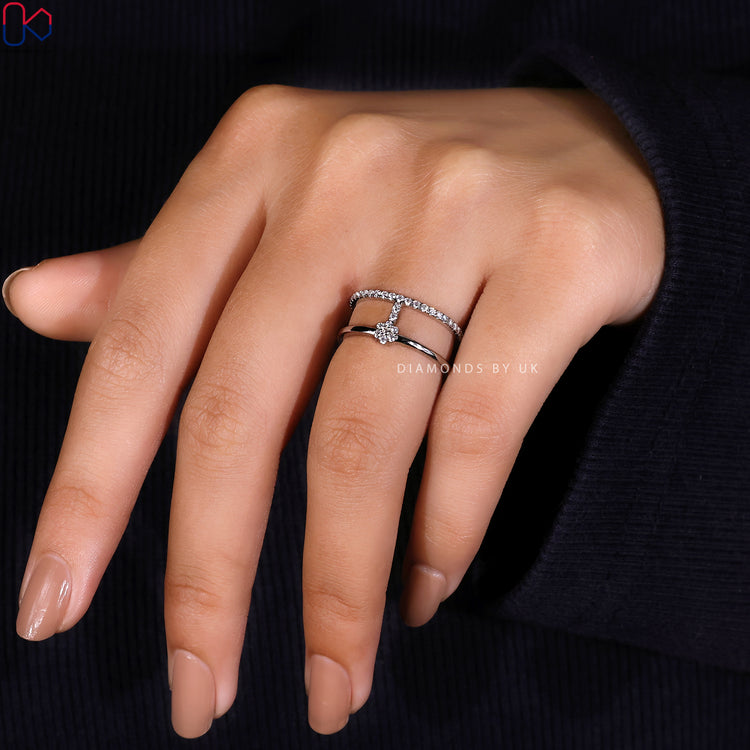 Round diamond wedding band with geometric band details.