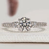Round diamond three stone ring with pavé style.