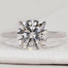 Round diamond engagement ring with hidden halo.