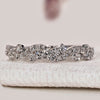 Round diamond wedding band with twisted pavé style.