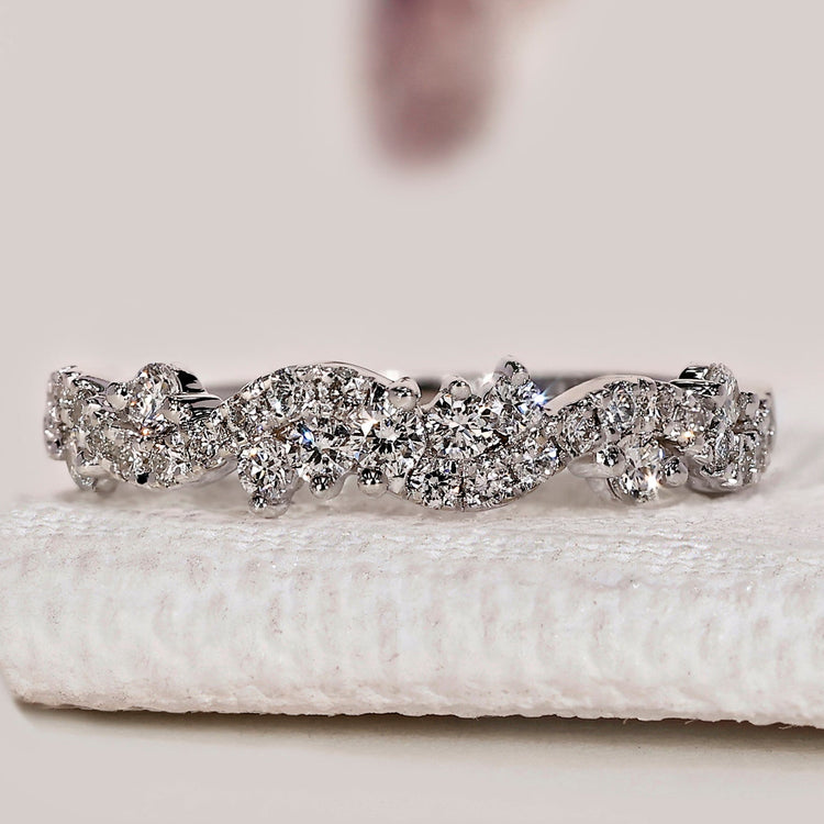 Round diamond wedding band with twisted pavé style.