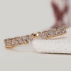 Marquise and round diamond wedding band crafted with a modern open structure.
