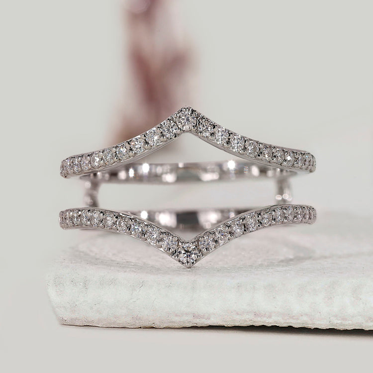 Chevron diamond insert ring band crafted to fit around solitaire rings with precision.
