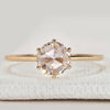 Round rose cut solitaire ring with six claw setting.