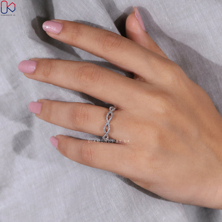 Diamondsbyuk wedding band with prong set lab grown stones.
