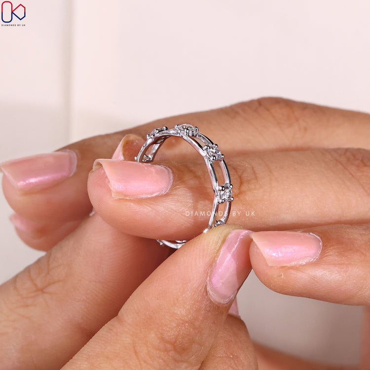 Customise wedding band with prong set wedding band features.
