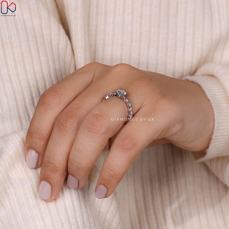 Handmade ring with marquise side stones and round center.
