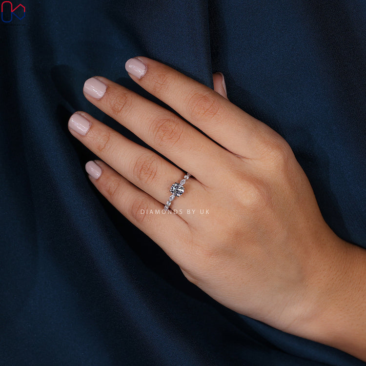 Diamondsbyuk ring featuring round diamond and bubble prongs.

