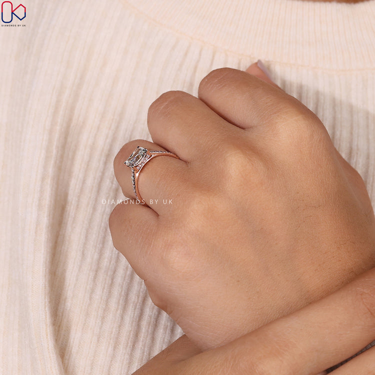 Rose gold engagement ring featuring a radiant cut diamond.
