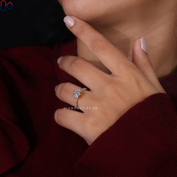 Tapered pave set engagement ring with sparkling accents.
