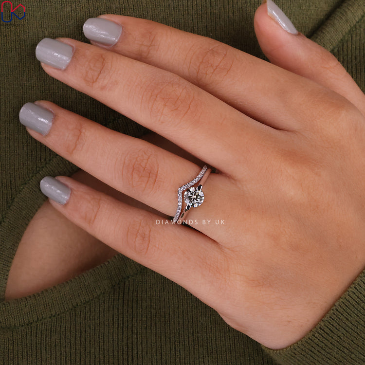 White gold bridal set with solitaire engagement ring and half eternity band.
