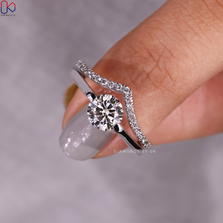 Diamondsbyuk bridal set with round diamond ring and half eternity band.
