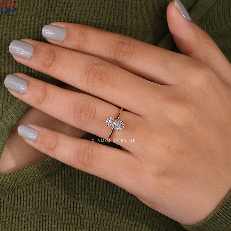 Round side diamond ring with 4 prong claw setting.
