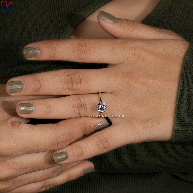 Diamondsbyuk ring and solitaire engagement ring.

