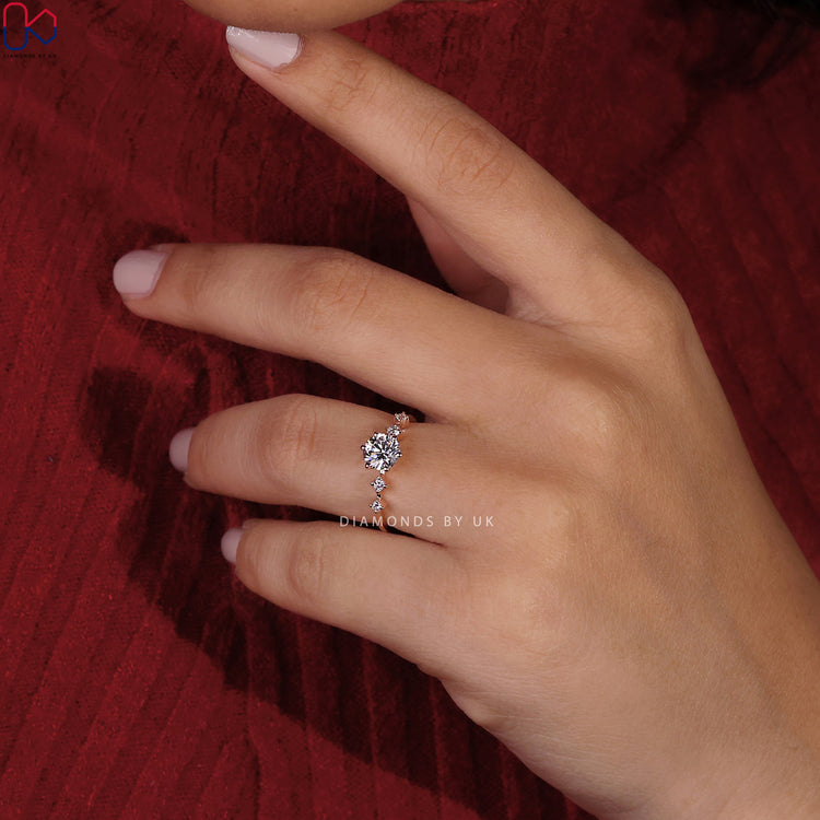 Round brilliant cut diamond ring in a rose gold band.
